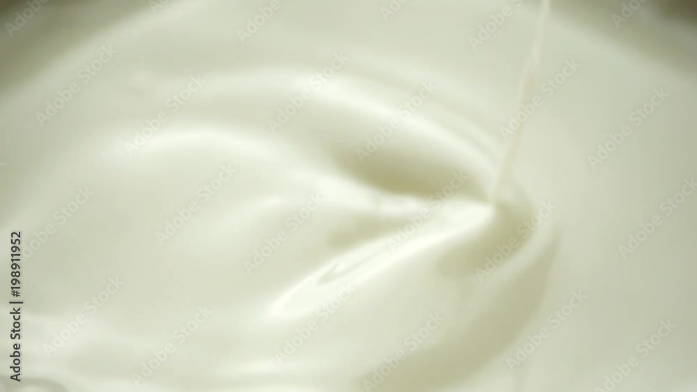 milk dropping and splashing in slow motion milk dropping and splashing in slow motion