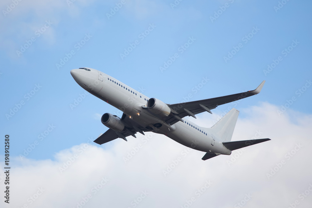 plain passenger airplane starting in a cloudscape plain passenger airplane starting in a cloudscape