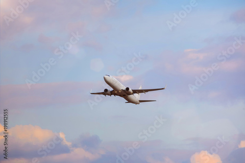 plain passenger airplane starting in a cloudscape