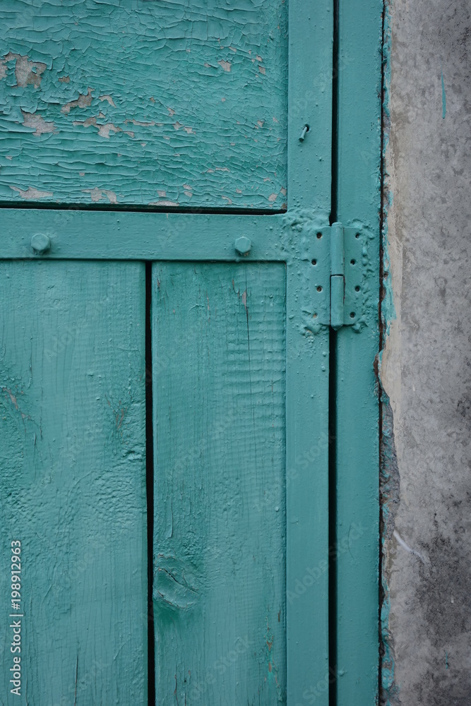 Old plank wooden wall background. The texture of old wood. Weathered piece of wood.