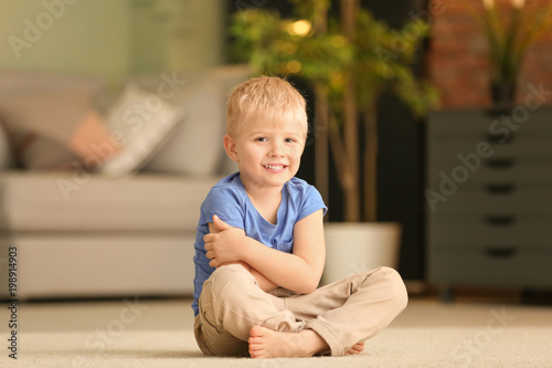 Cute little boy sitting on ...