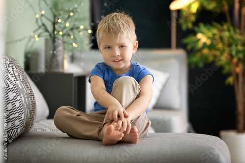 Cute little boy sitting on ...