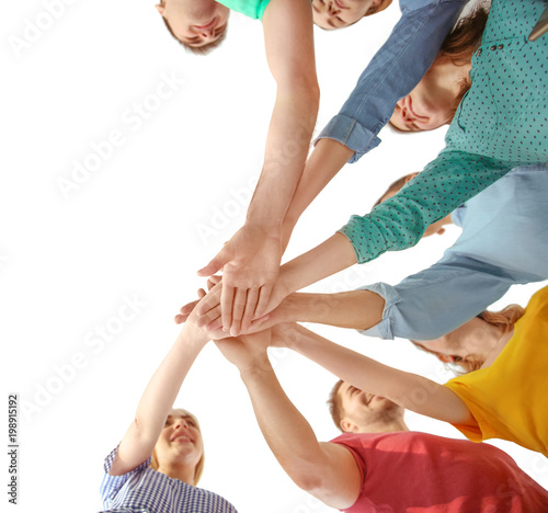 Young people putting hands ...