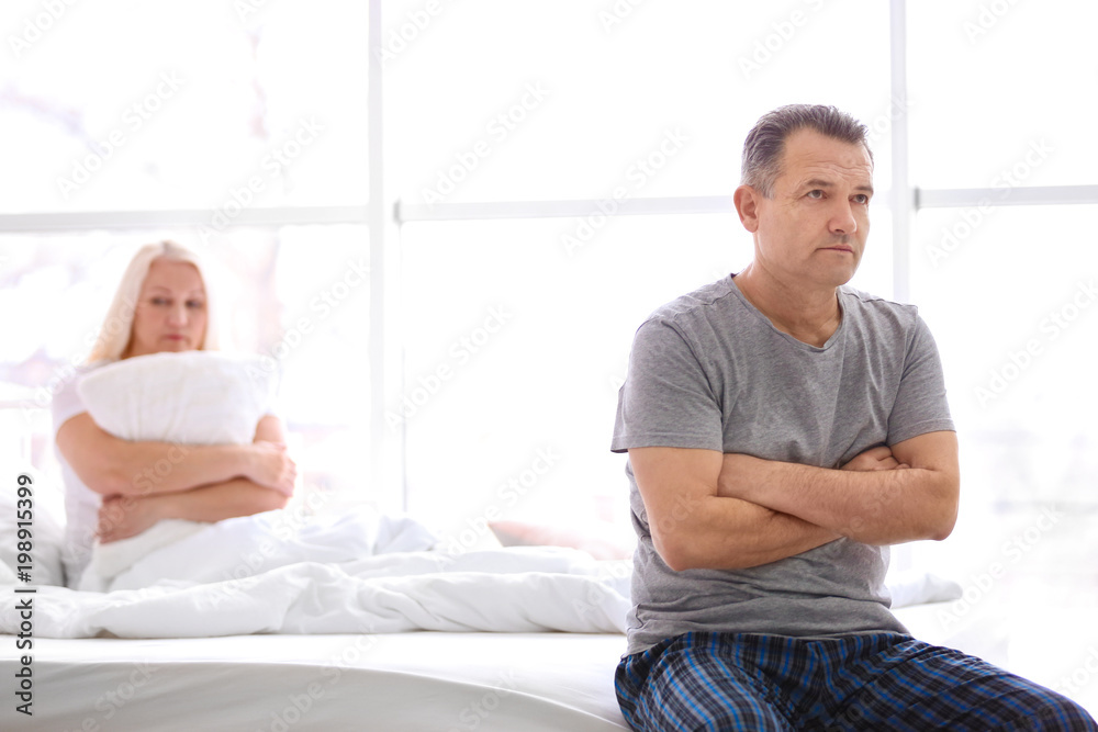 Obraz premium Senior couple with problem in relationship on bed at home
