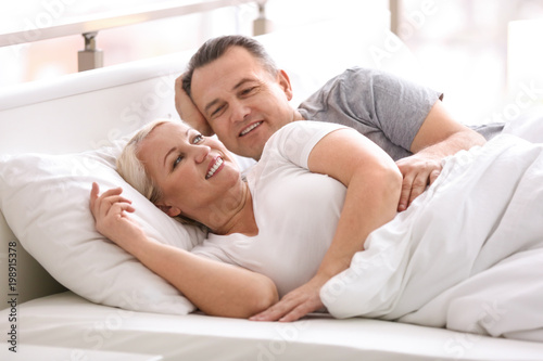 Senior couple in bed togeth...
