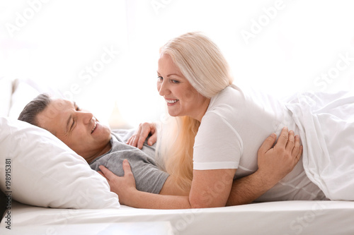 Senior couple in bed togeth...