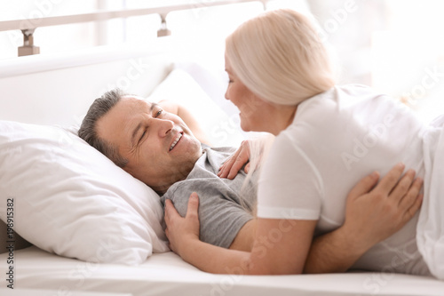 Senior couple in bed togeth...