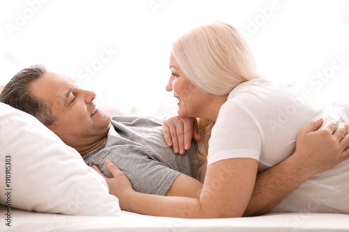 Senior couple in bed togeth...