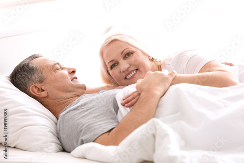 Senior couple in bed togeth...
