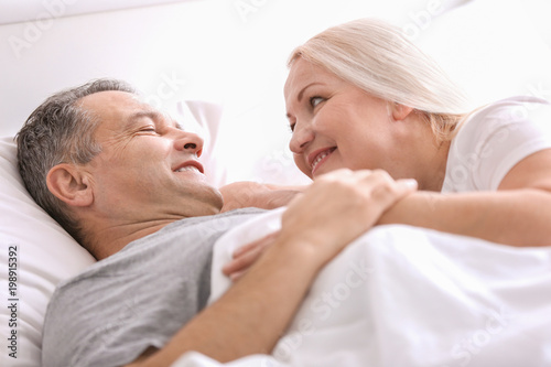 Senior couple in bed togeth...
