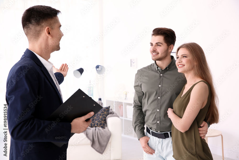 Real estate agent with clients in new house Real estate agent with clients in new house