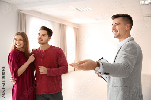 Real estate agent with clie...