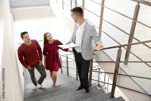 Real estate agent with clie...