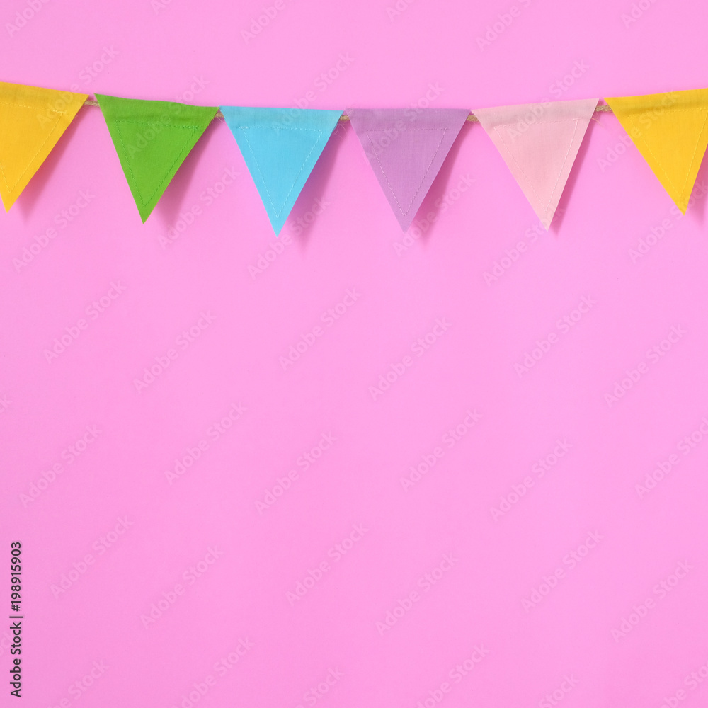 Colorful party flags hanging on pink background, birthday, anniversary, celebrate event, festival greeting card background