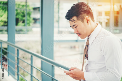 Businessman using tablet mobile phone in outdoor office Free Download Businessman using tablet mobile phone in outdoor office - GFXLoad