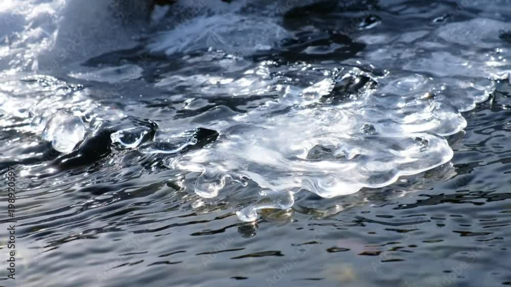 Video of closeup mooving along tracery edge of an ice floe on Altai creek in Spring season Video of closeup mooving along tracery edge of an ice floe on Altai creek in Spring season
