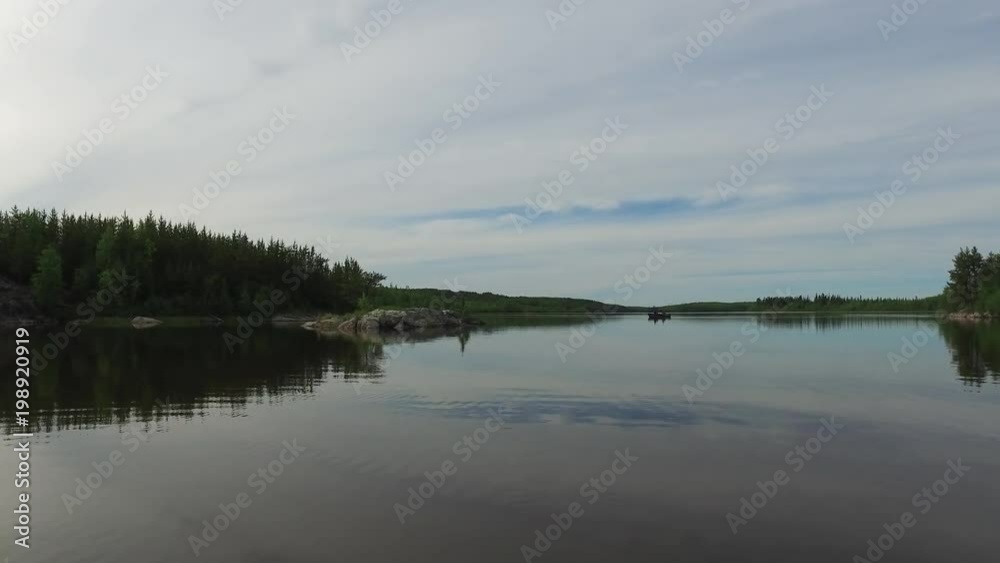 Scenery with lake surrounded by forest Scenery with lake surrounded by forest