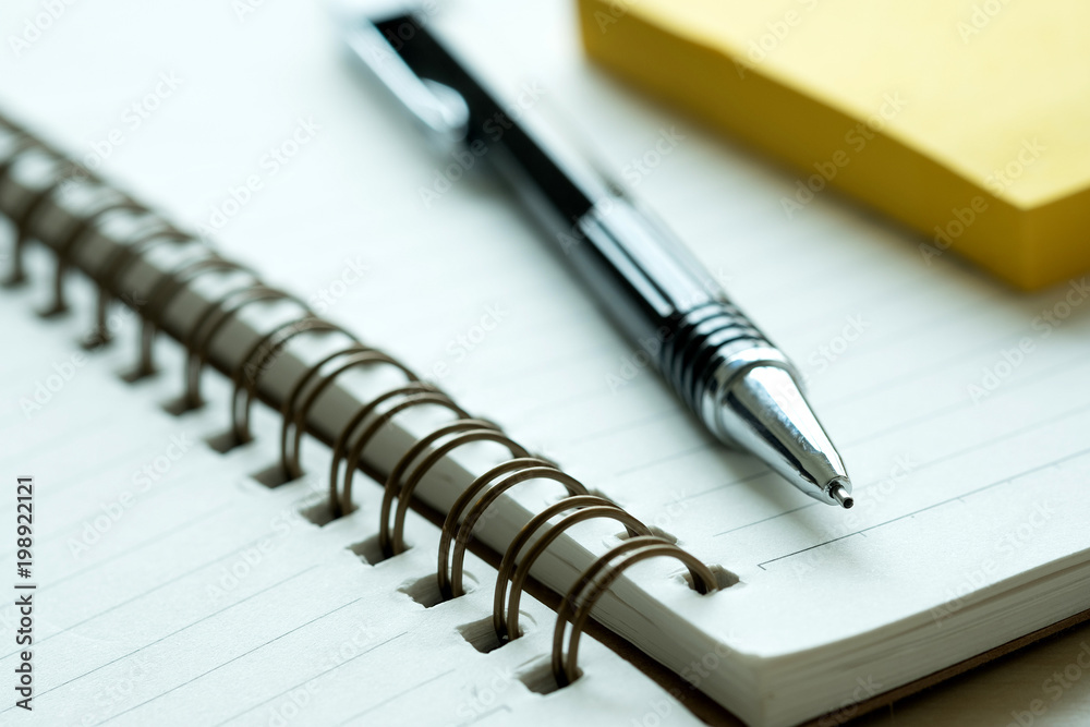 Top view of businessman blank notebook business document black pen Top view of businessman blank notebook business document black pen