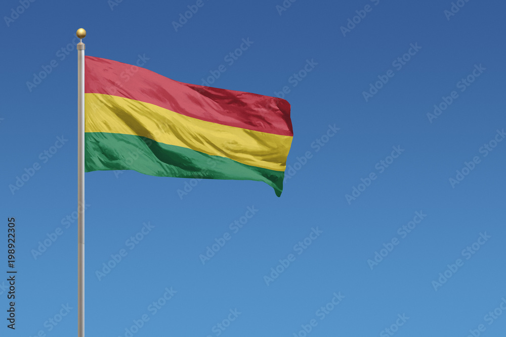 Bolivia flag on a clear blue sky day Bolivia flag on a clear blue sky day