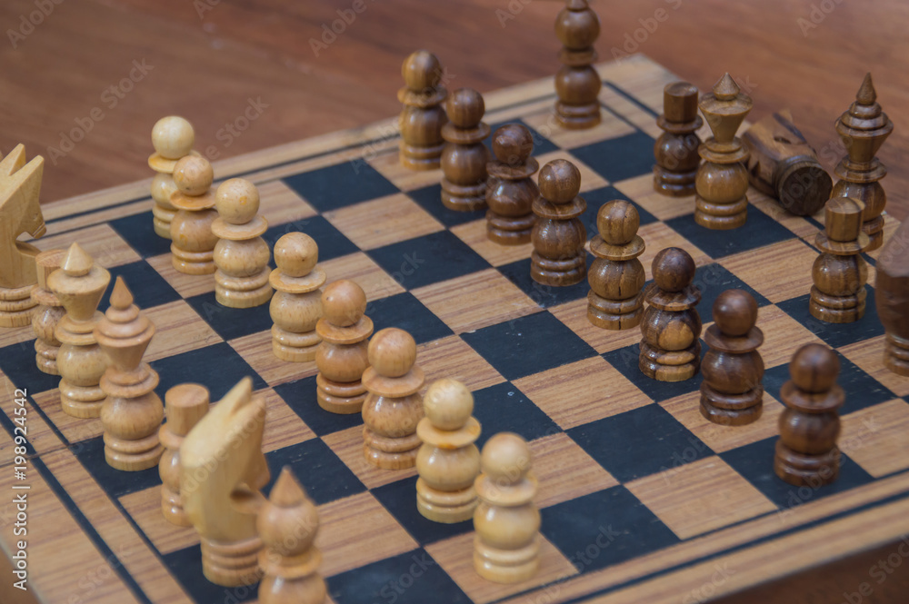 Leadership Concepts. Chess is a leader. Comparing chess is a strategic business plan. Businessman is playing chess. Chess game on a black background. Leadership Concepts. Chess is a leader. Comparing chess is a strategic business plan. Businessman is playing chess. Chess game on a black background.