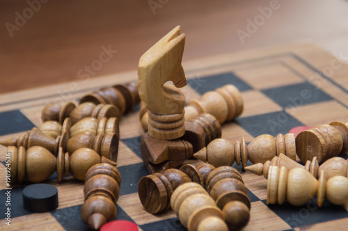 Leadership Concepts. Chess is a leader. Comparing chess is a strategic business plan. Businessman is playing chess. Chess game on a black background.