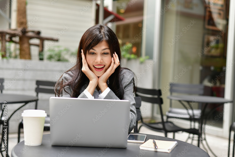 Business Concept.Young Asian businesswoman is working happily.Young businesswoman working in a cafe.Young businesswoman is relaxation in a coffee shop. Business Concept.Young Asian businesswoman is working happily.Young businesswoman working in a cafe.Young businesswoman is relaxation in a coffee shop.