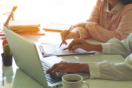 Business concept : People helping one of their colleague to finish new business plan.Brainstorming Business Working Report Concept