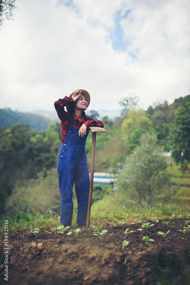 farmer woman .Planting trees in the garden