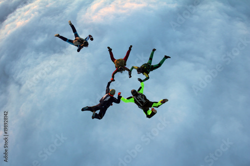 Skydivers are training in the sky.