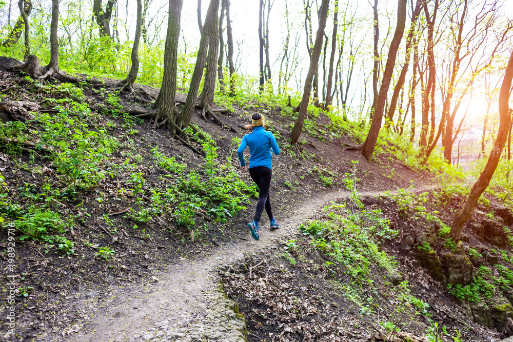 Obraz premium Girl running in the woods..