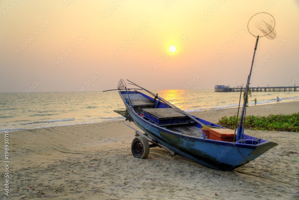 Sunset at anchor fishing boat at low tide Sunset at anchor fishing boat at low tide
