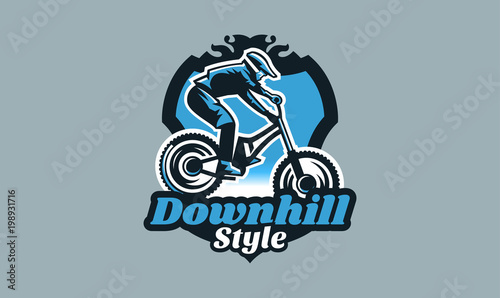 Colorful emblem, badge, logo of a rider on a mountain bike. Bicycle, transport, downhill, freeride, extreme, sports. T-shirt printing, vector illustration.
