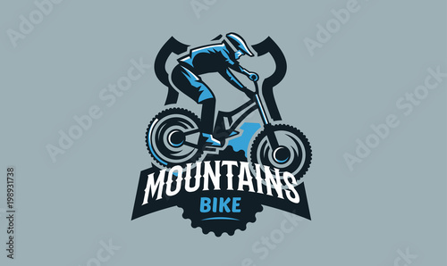 Colorful emblem, badge, logo of a rider on a mountain bike. Bicycle, transport, downhill, freeride, extreme, sports. T-shirt printing, vector illustration.