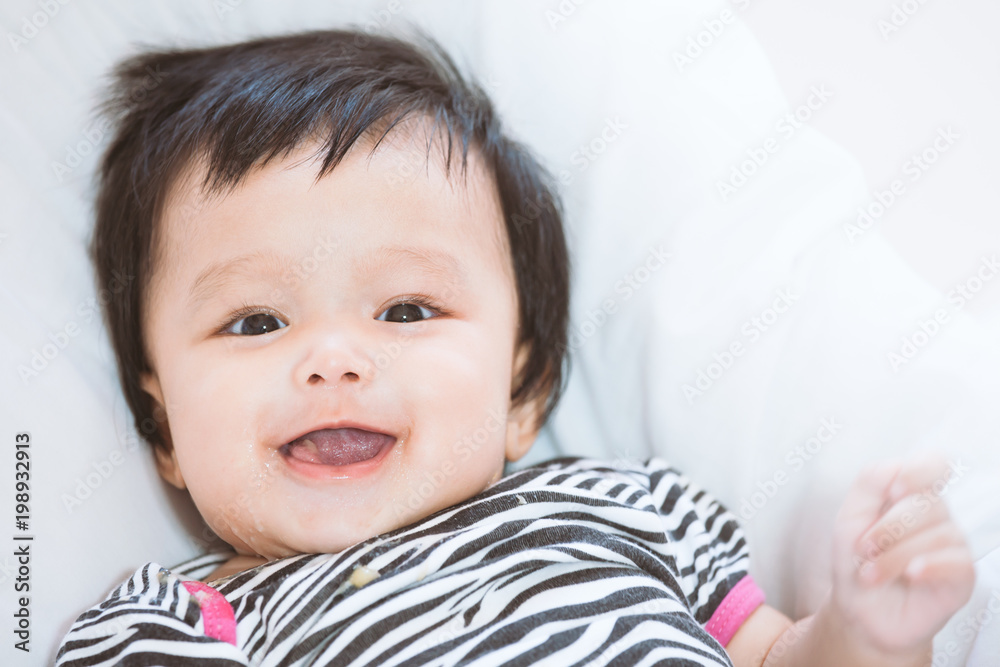 Cute asian baby girl smiling with happiness Cute asian baby girl smiling with happiness