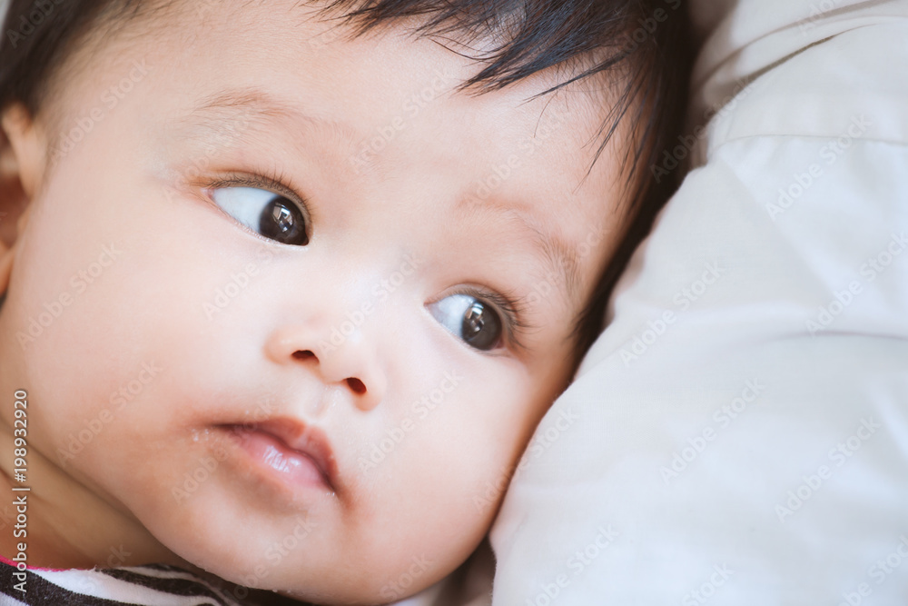 Portrait of cute asian baby girl lying down on her bed Portrait of cute asian baby girl lying down on her bed