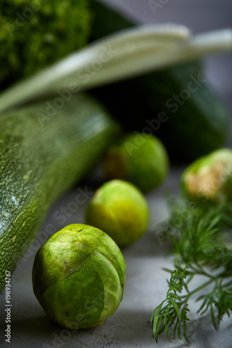 Fresh vegetables still life over white textured background, close-up, flat lay, shallow depth of field © Aleksey