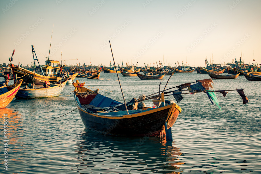 fishing boats crowd the water in vietnam