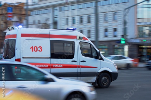 the ambulance rushes through the city in the stream. By car the Russian inscription " ambulance services"