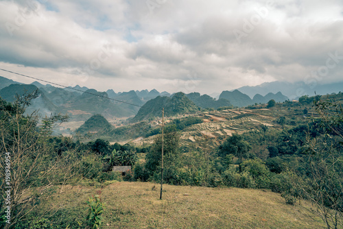 fog sweeps across the mountains of vietnam photo