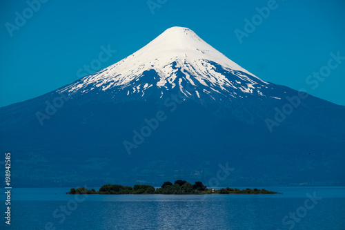 Volcano of Osorno and the island on the lake. Chile