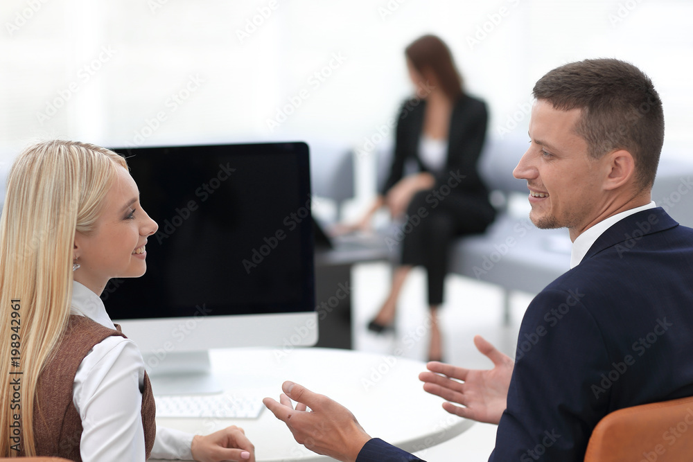 members of a business team discussing a successful business presentation. members of a business team discussing a successful business presentation.