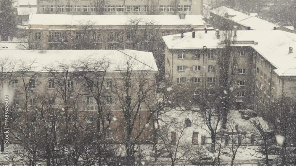 Slow motion of falling snow at the city. Nice winter background. Winter Slow motion of falling snow at the city. Nice winter background. Winter