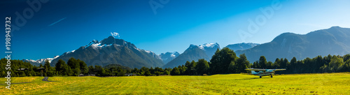 Photos Airport with green grassy runaway in the rural area among the Patagonian mountai