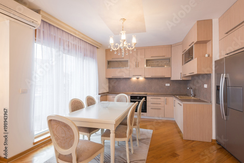 Open plan apartment interior, kitchen and dining area