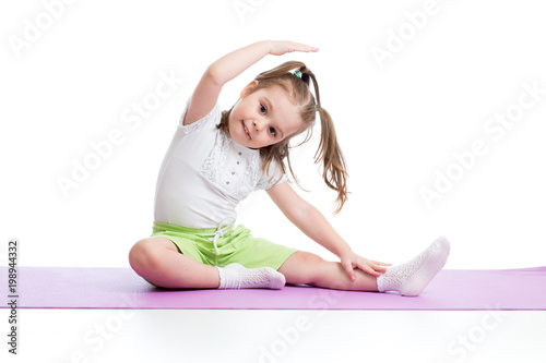 Child girl practicing yoga,...