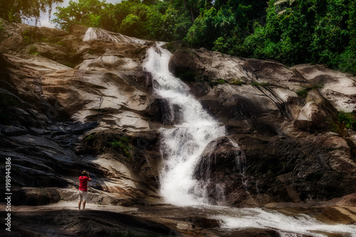 Foto Water fall with photographer and beautiful view nature dark color style, Karom w