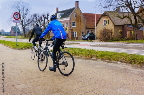 Cyclist riding mountain bike . Romantic couple cycling together . Healthy lifestyle