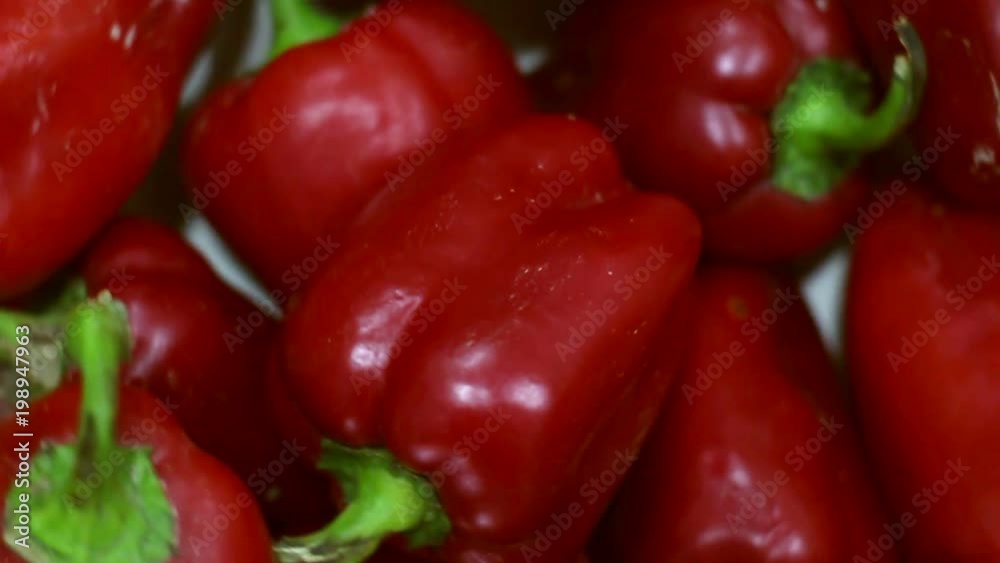 Red organic peppers rotating. Loopable top view. Red organic peppers rotating. Loopable top view.