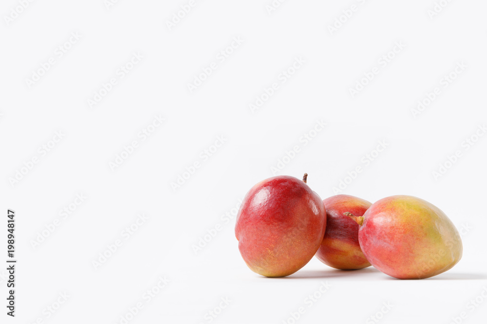 close up view of fresh mango fruits isolated on white close up view of fresh mango fruits isolated on white