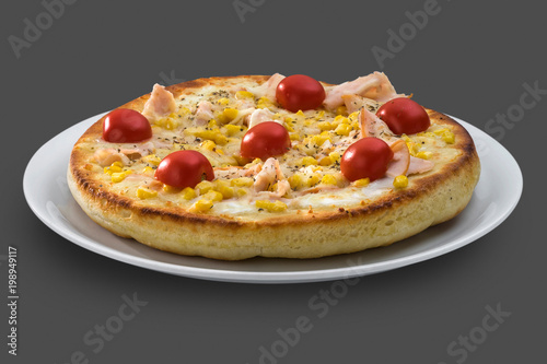 Italian pizza with cherry tomatoes, ham and sweet corn